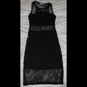 Black fishnet mini dress.